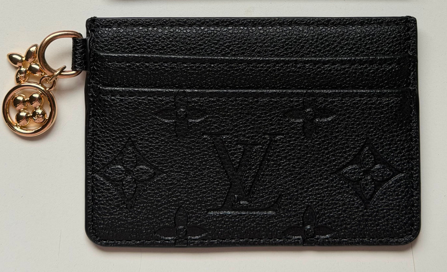 Louis Vuitton Monogram Empreinte LV
Charms Card Holder