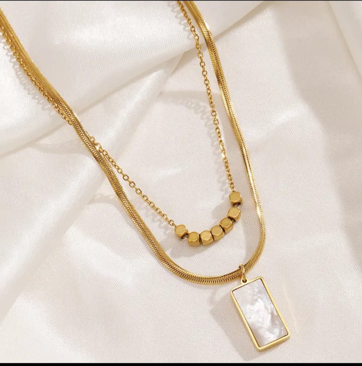Sentials white jade pendant