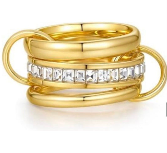 Gold link band with baguette crystals ring