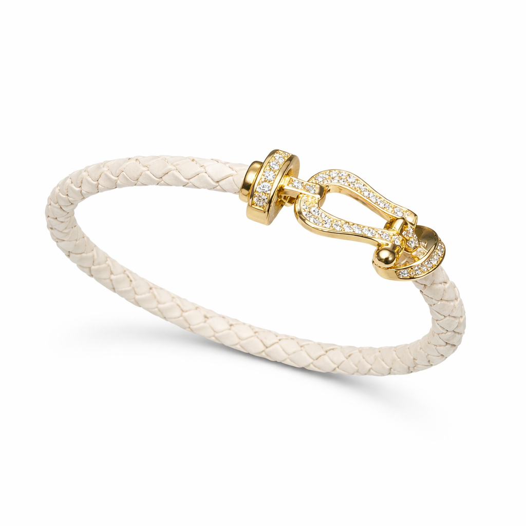 Lauren sigman ig white braided leather bracelet with a gold crystal-encrusted buckle clasp.