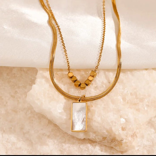 Sentials white jade pendant