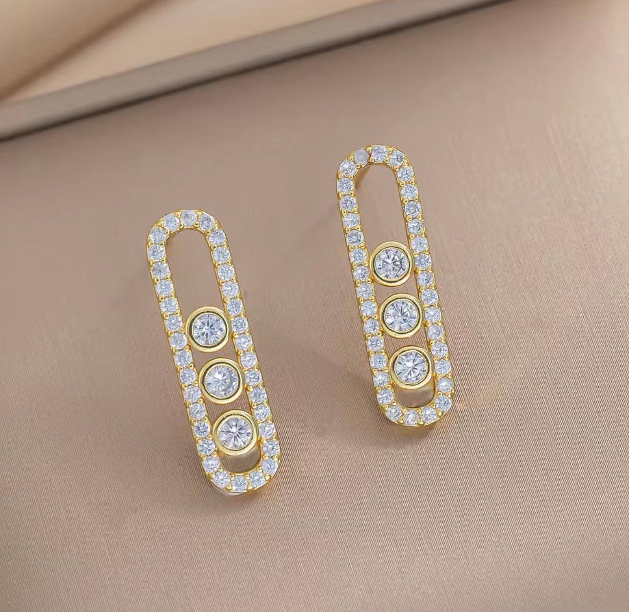 Golden Messika oval frame earring