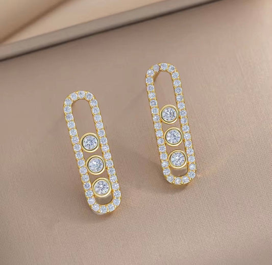 Golden Messika oval frame earring