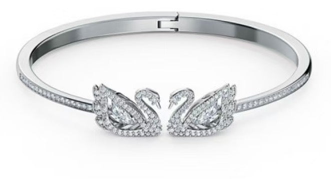 Swarovski Dancing Swan Bangle Bracelet (White Stones) – Comes in original brand packaging.