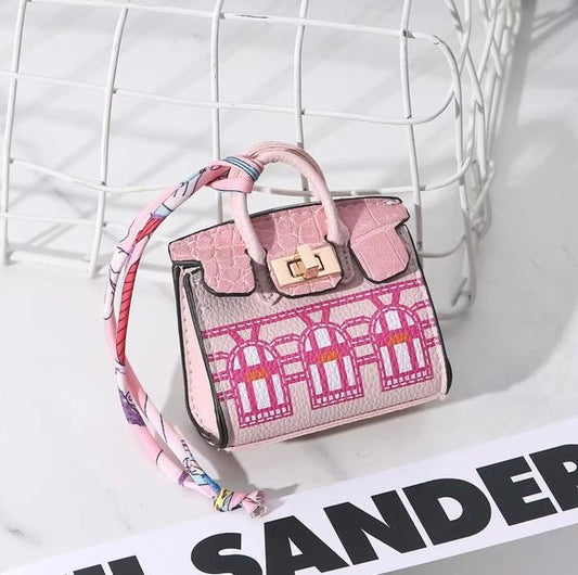 Light pink Hermes Fauxborg Mini bag charm