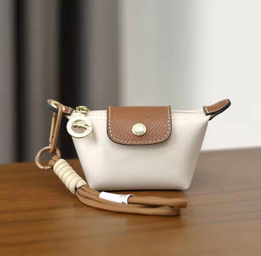 White Longchamp mini bag charm keychain