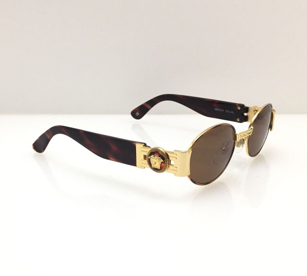 metal frame Versace glasses