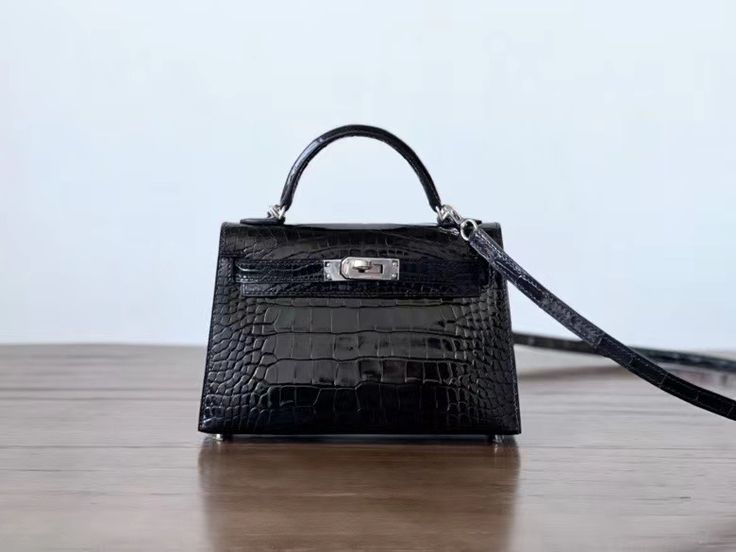 Black textured sliver hardware Mini Kelly bag
