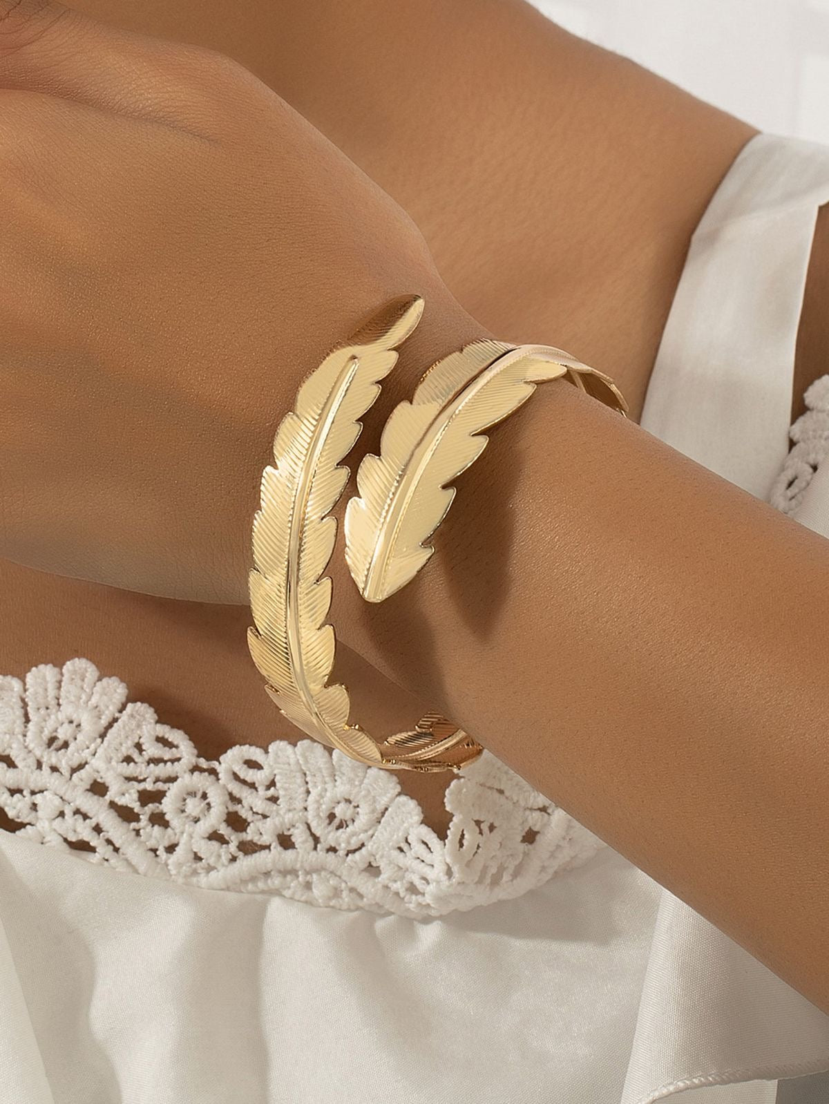 Gold feather arm bracelet