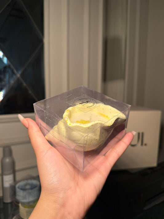 Yellow shell scented candle