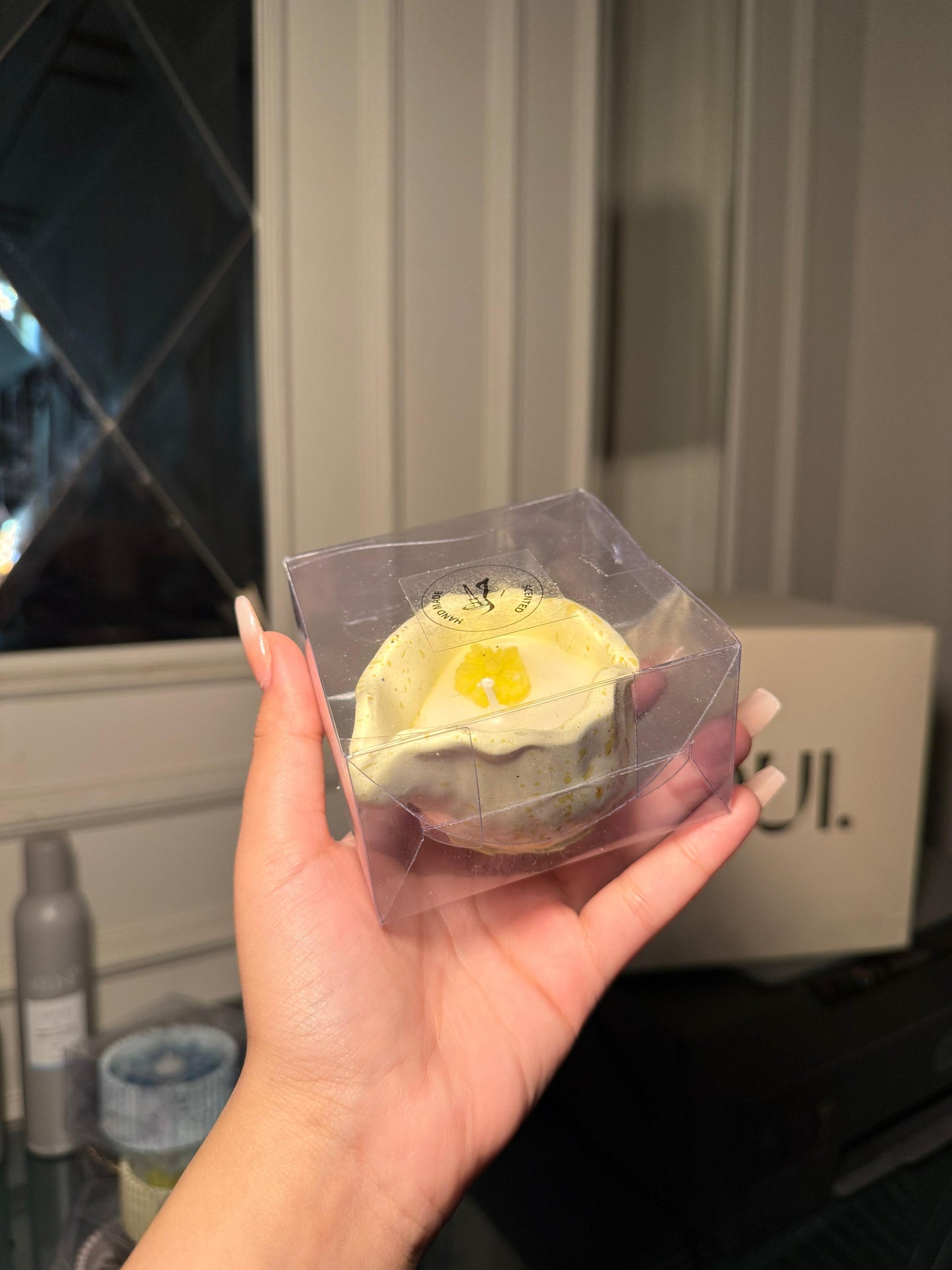 Yellow shell scented candle