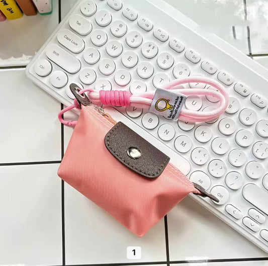 Peachy pink Longchamp mini bag charm keychain