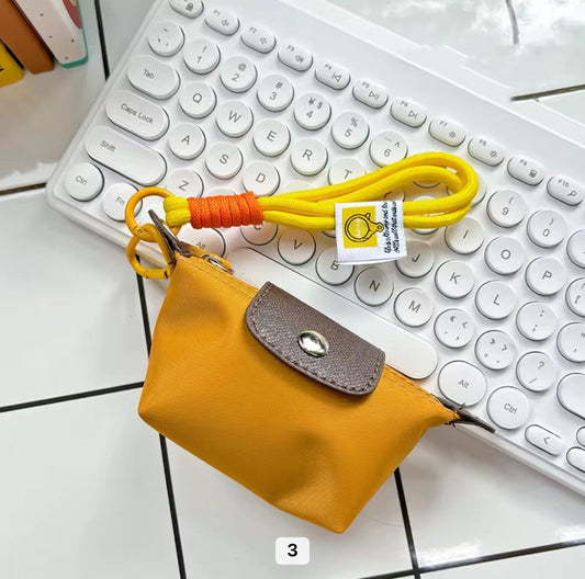 Mustard Longchamp mini bag charm keychain