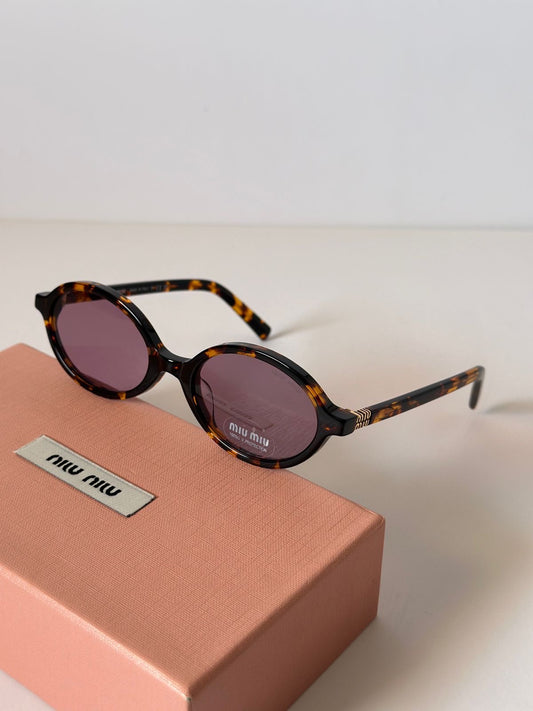 Miu Miu oval brown cheetah glasses
