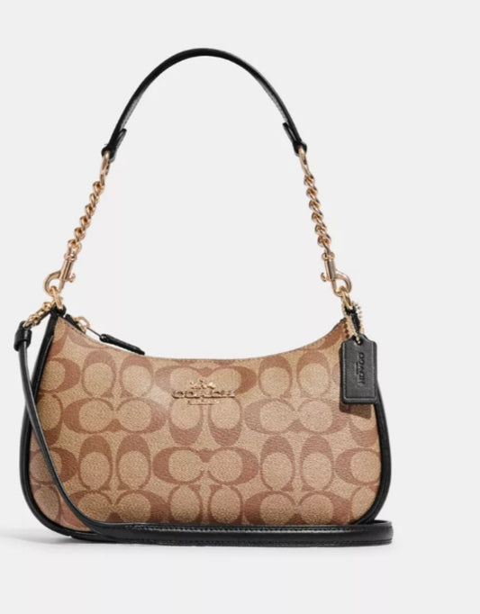 Black and brown Coach shoulder bag